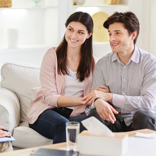 counselor and happy couple after effective marital 6GBE9L5