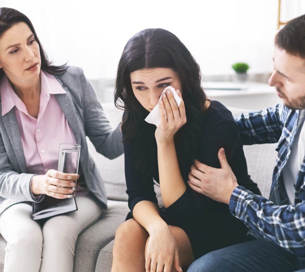 loving husband calming his crying wife at psychoth E93YAHK